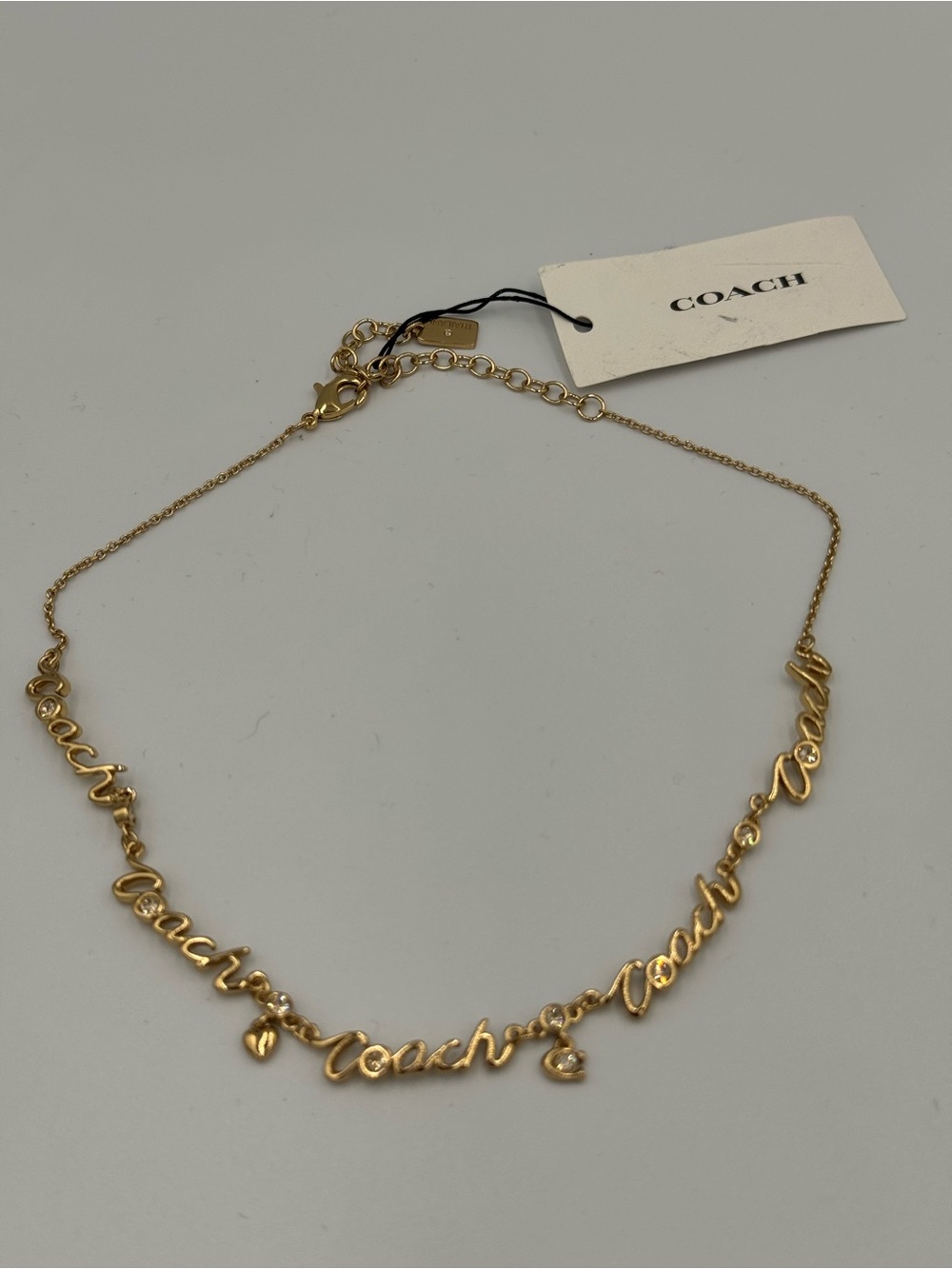 COACH Gold Script Logo Link Necklace with Heart, Sparkles and Signature C Charm